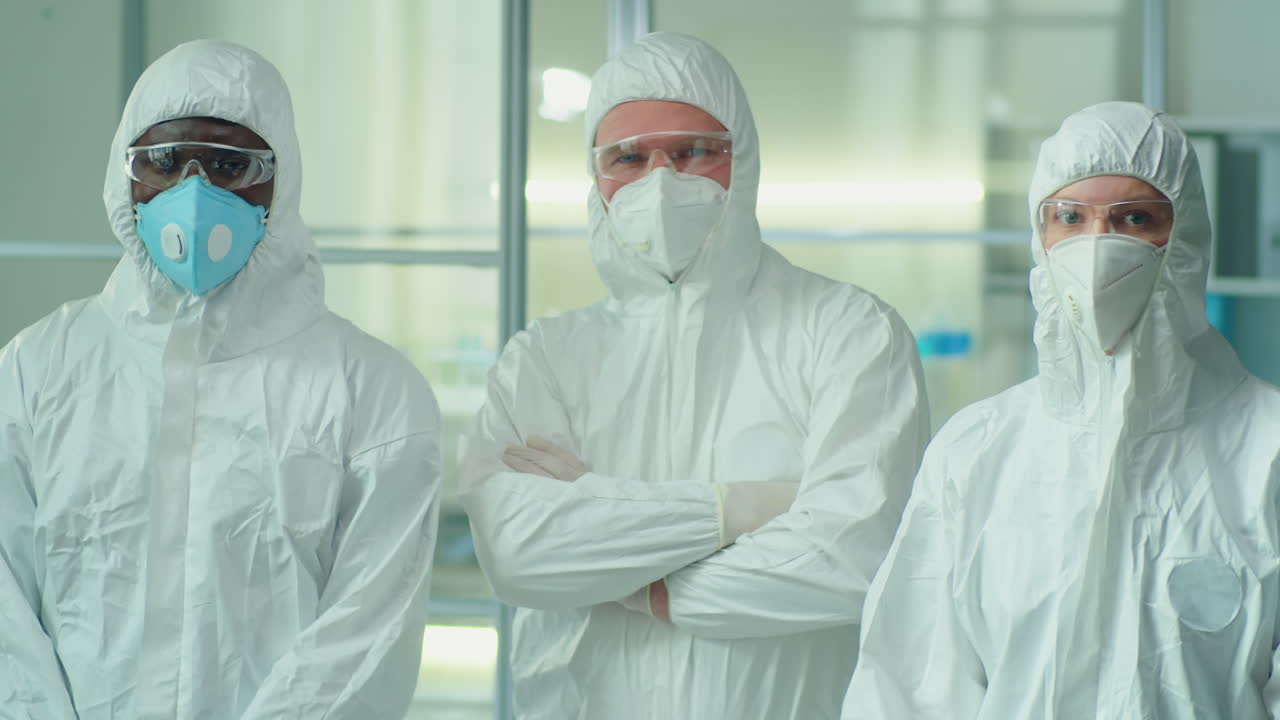 Portrait of Multiethnic Lab Workers in Protective Uniforms