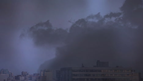 lightning in clouds over a city