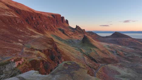 Rocky-cliffs-bathed-in-winter-dawn-light-with-slanted-landslip-features