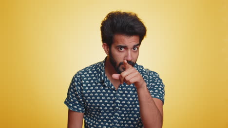 Indian-man-pointing-at-his-eyes-and-camera-show-I-am-watching-you-gesture-spying-watching-on-someone