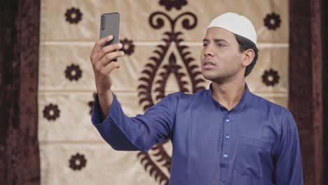 Indian-Muslim-man-talking-on-video-call