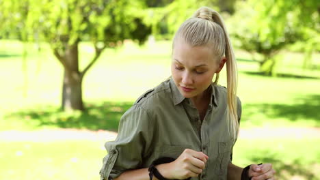 fit blonde stretching before a hike