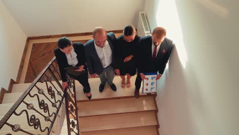 top view of business colleagues climbing up together on stairs