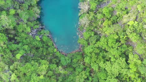 Drone-shot-of-limestone-karst-scenery-and-turquoise-ocean-water-in-Coron-Island,-Palawan,-Philippines