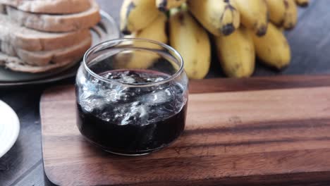 Blue-berry-jam-in-container-on-table