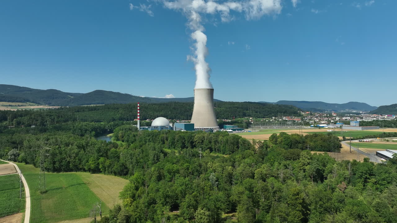 Nuclear power plant G&ouml;sgen Switzerland on sunny afternoon, drone pedestal shot