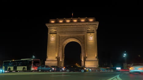 triumphal arch in bucharest at night