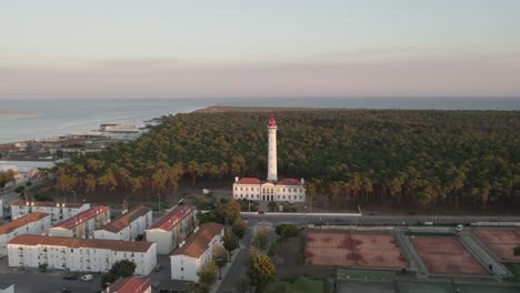 vila real de santo antónio lighthouse against lush coastal forest