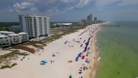 revealing aerial shot of orange beach coastline on an overcast day