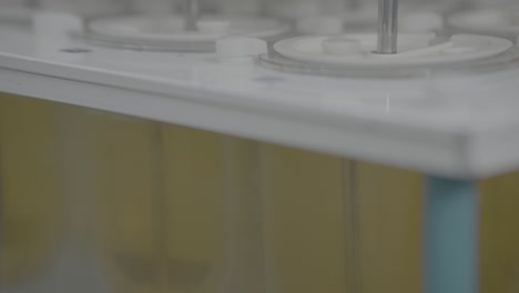 medical tables quality check when dissolved in liquid slog footage.