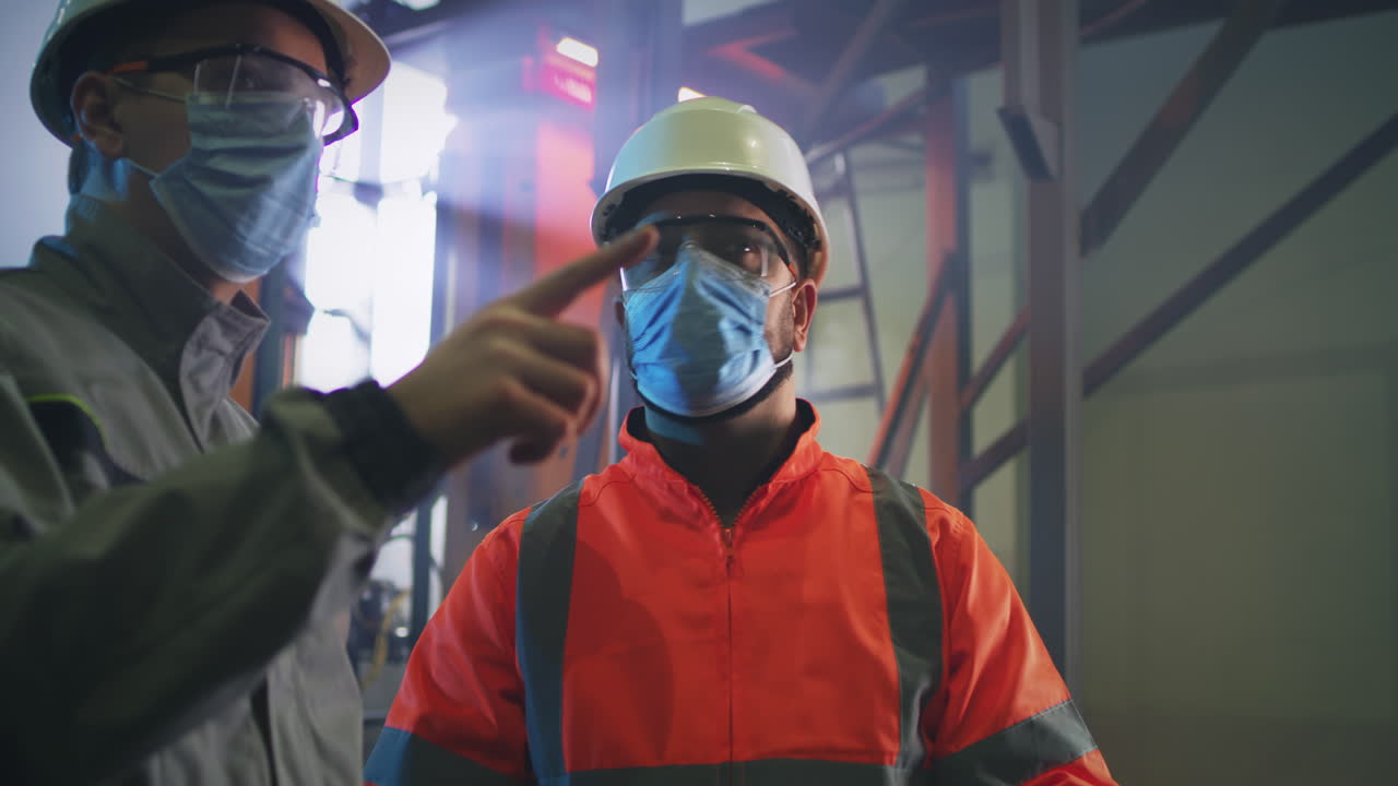 Industrial Workers Discussing in a Factory