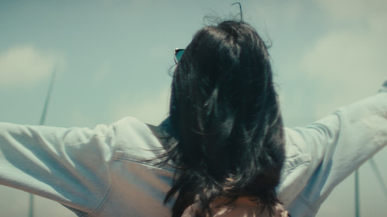 Woman enjoying the view at a wind farm