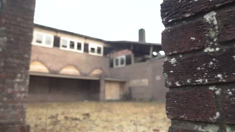 abandoned brick building with broken windows and a collapsed roof