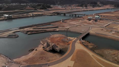 Aerial-flight-over-building-destroyed-by-Tsunami-in-Japan