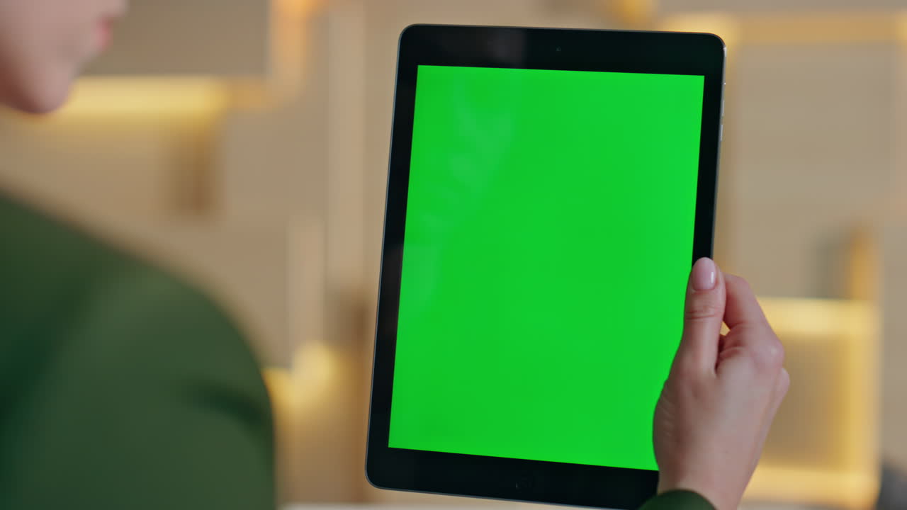 Woman choosing purchases mockup tablet at home close up. Girl hands swiping pad