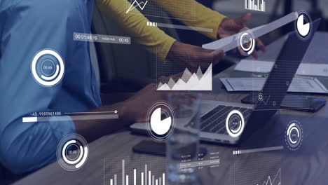 analyzing financial data on tablet and laptop, business charts animation over scene