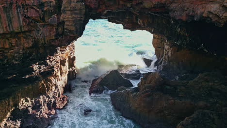 huge ocean wave break coastal cliffs foaming splashing in super slow motion.