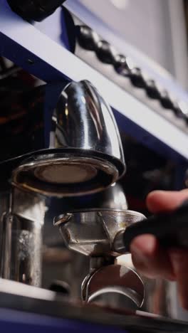 barista preparing coffee at a professional coffee machine