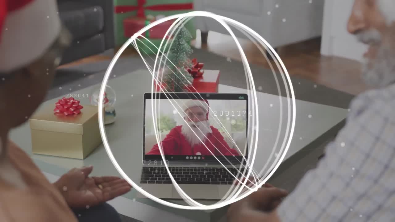산타클로스와 함께 노인 커플의 노트북 비디오 통화에서 회전하는 바 ⁇ 의 애니메이션
