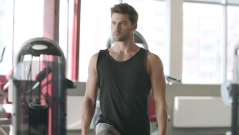 man bodybuilder using dumbbells for lunges squat at sport training in fitness