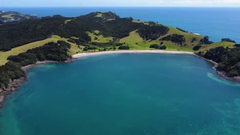aerial approach of a secluded beach in bay of islands, new zealand