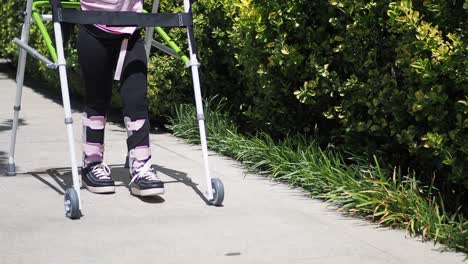 child using a walker for rehabilitation