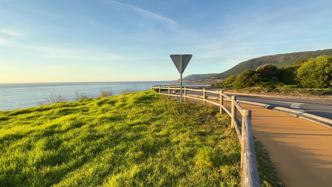 Curved Road on the Shores of North Atlantic Ocean That Leads to Camino de Santiago