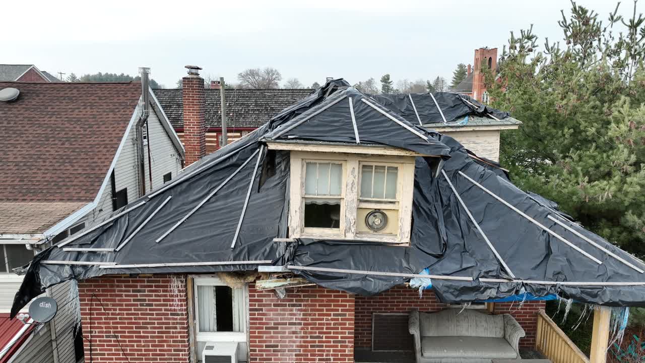 Aerial rising shot of abandoned house