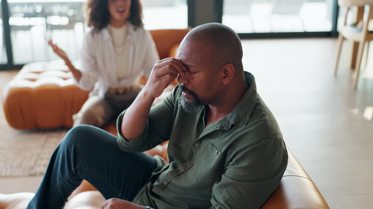 A couple experiencing conflict during therapy