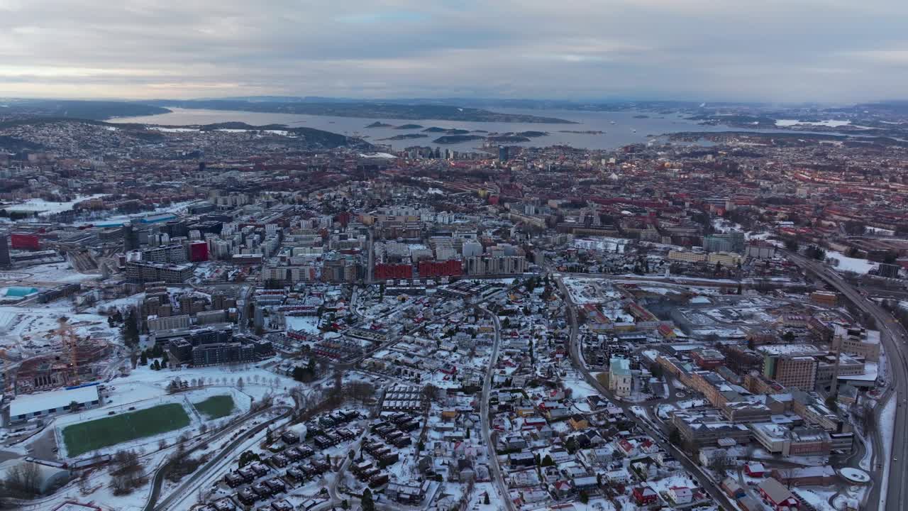 Winter cityscape landscape Oslo Norway Norge downtown OsloFjord water Fjord arctic circle Scandinavia Gamle Hovedoya early morning snowy sunny blue skies clouds buildings cars highway roads forward