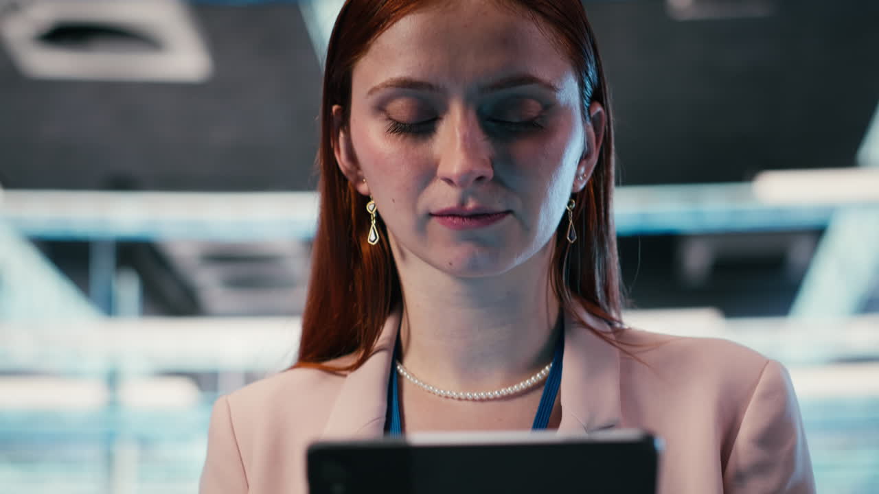 Young Woman Using Digital Tablet with Serene Expression