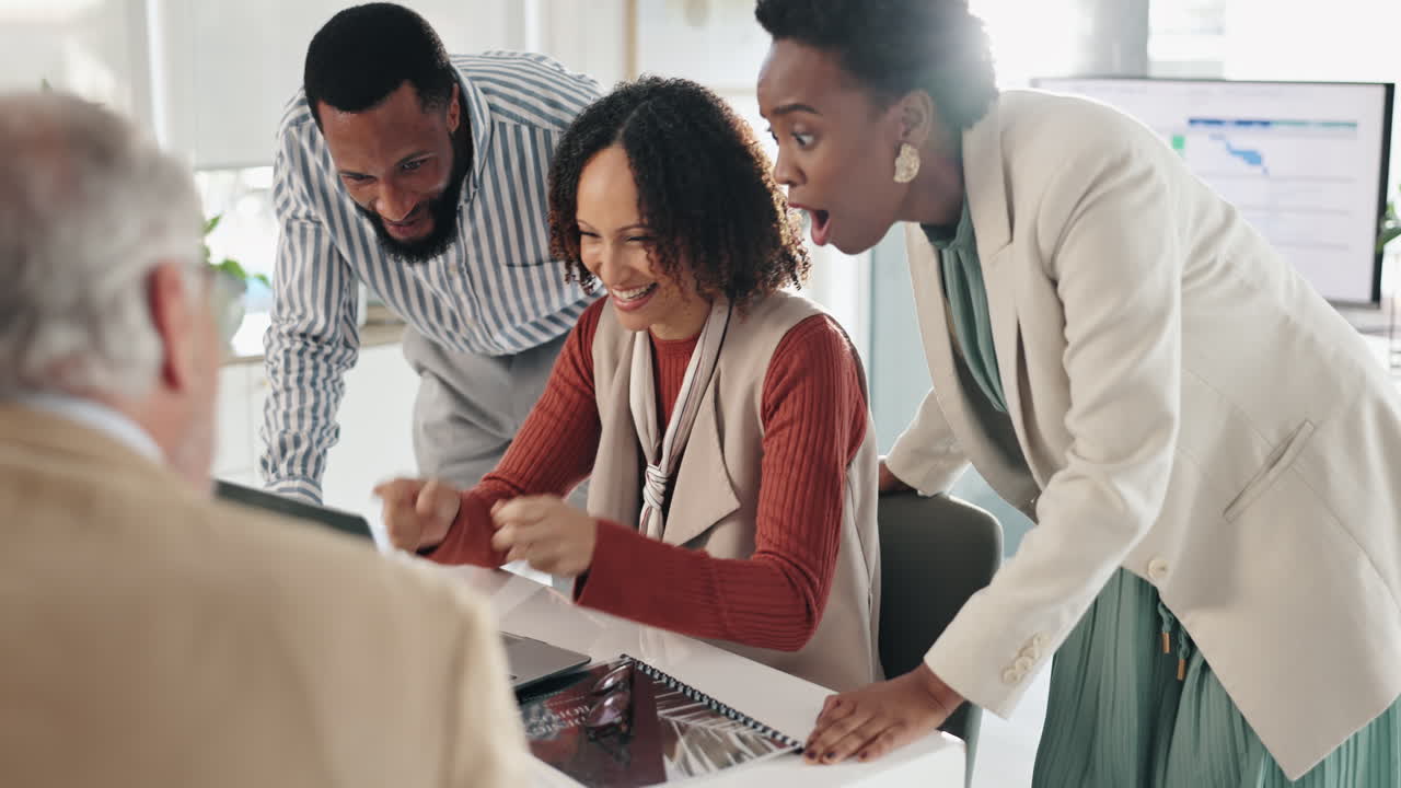 Successful Business Team Celebrating Achievement in the Office