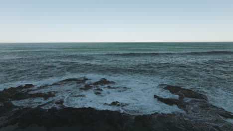 aerial static of thor's well on the oregon coast, showcasing the wide expanse of cape perpetua's rocky shoreline