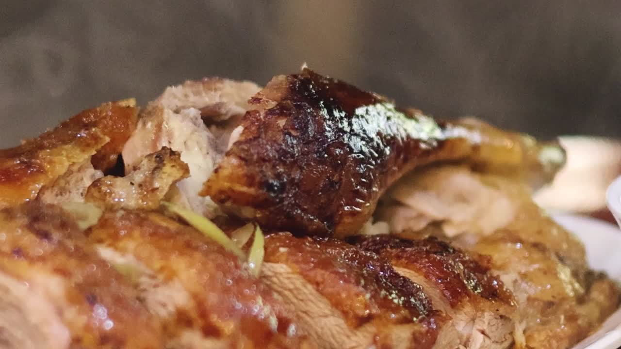 Detailed view of succulent roasted duck slices with crispy skin, showcasing rich textures and glistening glaze.