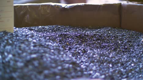 a large pile of tiny metal pieces with label