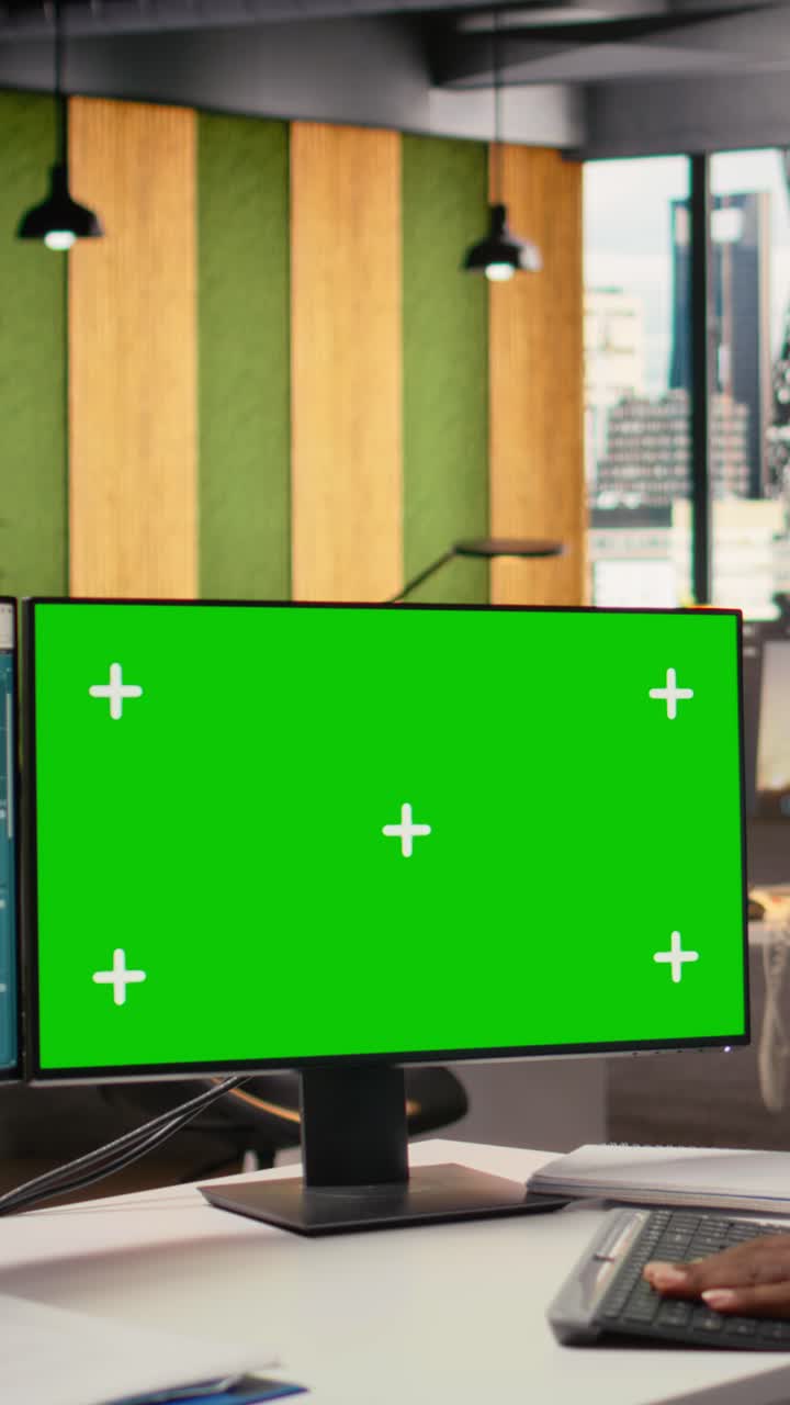 Technician works on power line tower CAD design on green screen PC in office