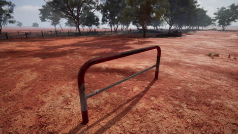 red dirt outback: a solitary barrier in the australian desert