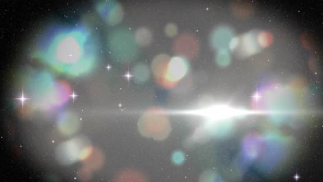 animation of light spots and stars over black background