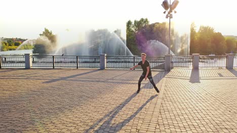 young boy dancing. joyful positive hipster man actively dancing near river