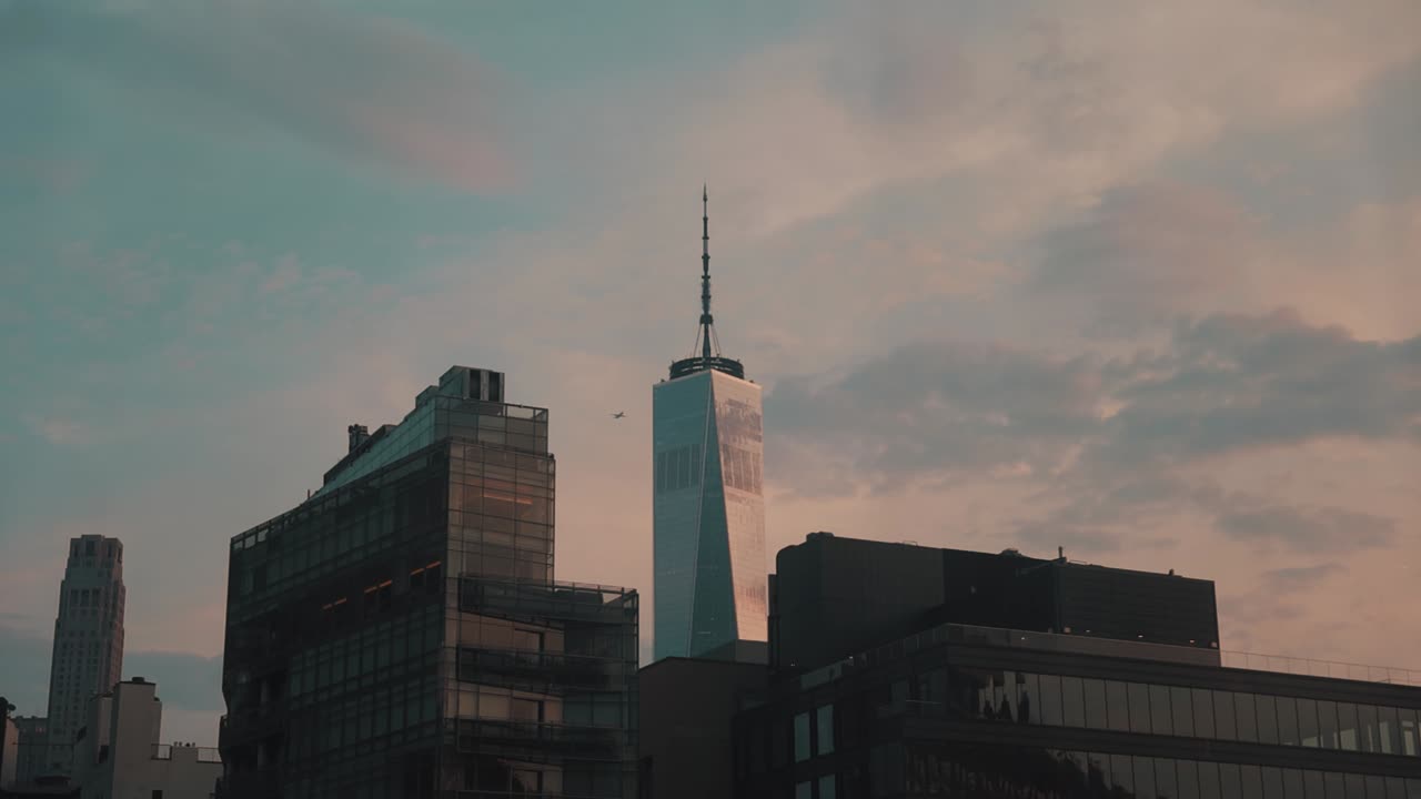 Stunning view of the Freedom Tower against a sunset sky
