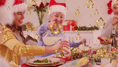 Golden-star-against-caucasian-mohter-pouring-drink-in-a-glass-while-having-dinner-during-christmas