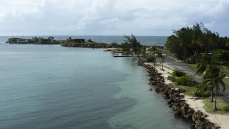 Isla-De-Cabras---Aerial-flight-over-the-coast-towards-the-Ruins-of-Antiguo-Leprocomio