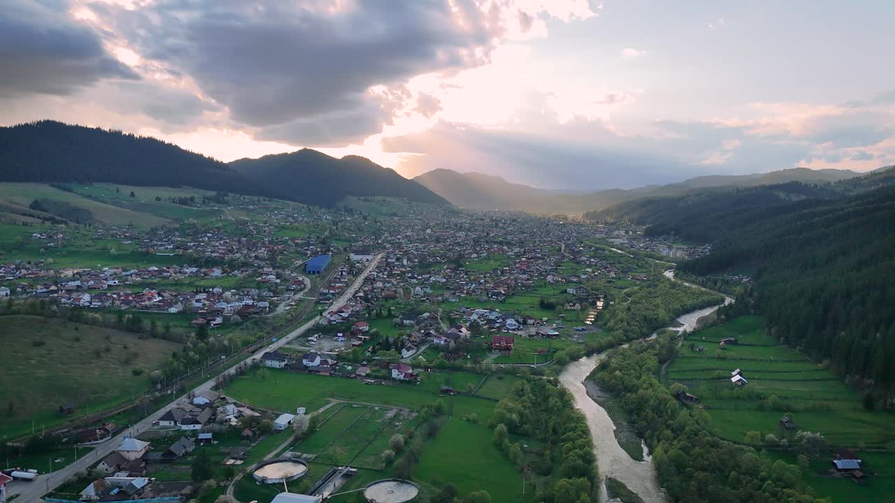 Drone aerial video of sunset over Campulung city and Moldova river