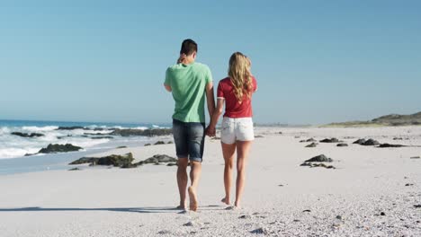 couple in love enjoying free time on the beach together
