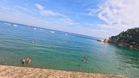 people enjoying the sea and scenic coastline