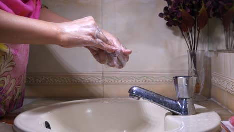 woman washing hands