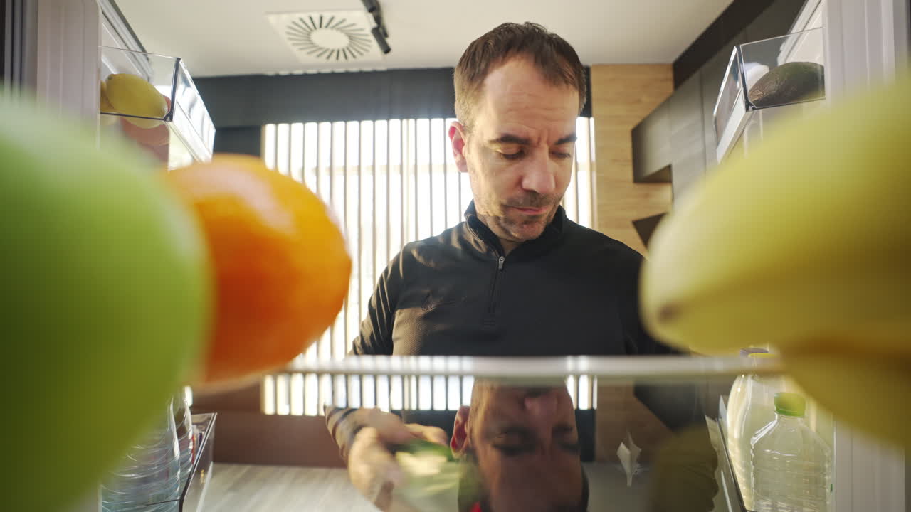 Man looking in the refrigerator