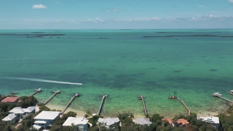 speedboat passing by jetty in the florida keys at daytime in usa