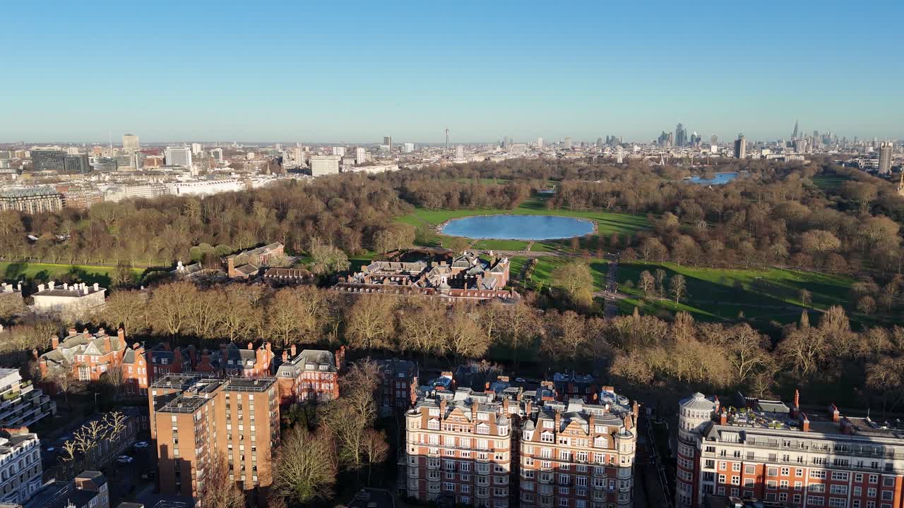 Kensington London. UK Hyde park and city skyline clear blue sky
