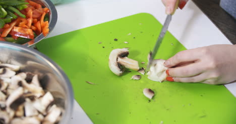 Woman-Hand-Cutting-Mushrooms-Fungi-1